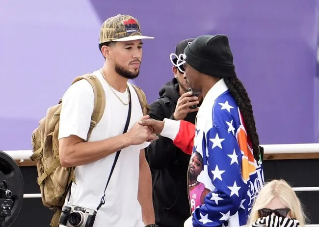 Aug 7, 2024; Paris, France; USA basketball player Devin Booker and Snoop Dogg during the skateboarding park final during the Paris 2024 Olympic Summer Games at La Concorde 4. © Rob Schumacher-Imagn Images