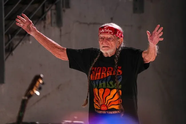 Musician Willie Nelson takes the stage during a rally for Vice President Kamala Harris at Shell Energy Stadium on Friday, Oct. 25, 2024 in Houston, Texas.