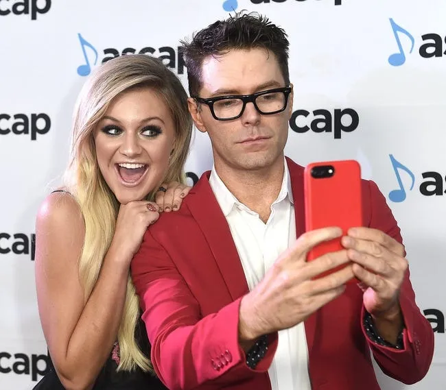 Kelsea Ballerini, left, and Bobby Bones take a photo on the red carpet of the annual ASCAP Country Music Awards show at the Ryman Auditorium in Nashville on Oct. 31, 2016. Ballerina graduated from Centennial High School in Franklin, Tenn., in 2011.