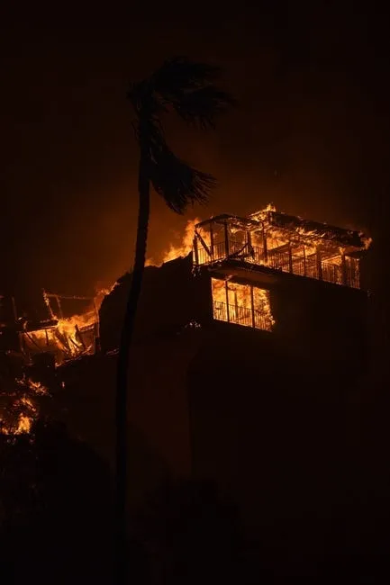 Jan 8, 2025; Pacific Palisades, CA, USA; A home is engulfed in flames in the Pacific Palisades neighborhood.