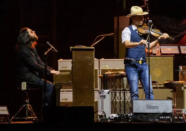 Keyboardist Logan Metz, left, and a fiddle player perform with Lukas Nelson and Promise of the Real as one of the opening acts for Whiskey Myers on Friday, May 10, 2024 in Carver Arena at the Peoria Civic Center.