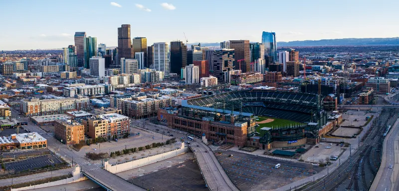 Aerial panorama of ballpark during rush hour during Covid-19 stay at home policy in Denver.