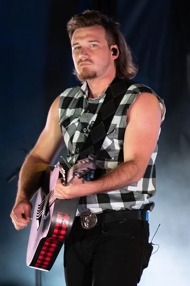 Morgan Wallen, an American country music artist performs his hit single “Whiskey Glasses” during Freedom Fest, June 28, 2019, at the Iron Horse Park, Fort Carson, Colorado.