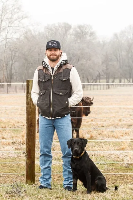 Chase Rice and his dog Jack, stand in front a heard of bison that are kept on his property in Franklin, Tenn. on Feb. 1, 2023.

Chase Rice Discusses His Latest Album