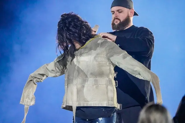 Illusionist Criss Angel performs a feat inspired by one performed by Harry Houdini, during the Colts Kickoff Concert on Friday, Sept. 8, 2023, at Lucas Oil Stadium in Indianapolis. For the feat, Angel was suspended 150ft while escaping a strait jacket in under five min, to break Houdi's record.