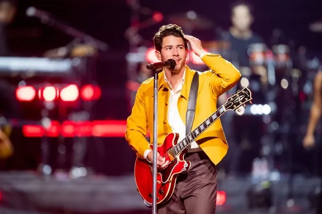 Sept 6, 2023; Phoenix, AZ, USA; Nick Jonas fixes his hair during the Jonas Brothers   performance at Footprint Center on Sept. 6, 2023.