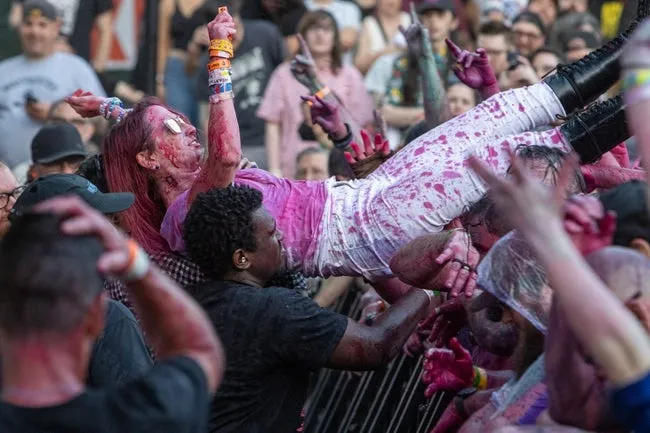 A FEST 21 attendee crowd surfs to the front of Bo Diddley Plaza during the GWAR set in downtown Gainesville, Fla. on Oct. 27, 2023.