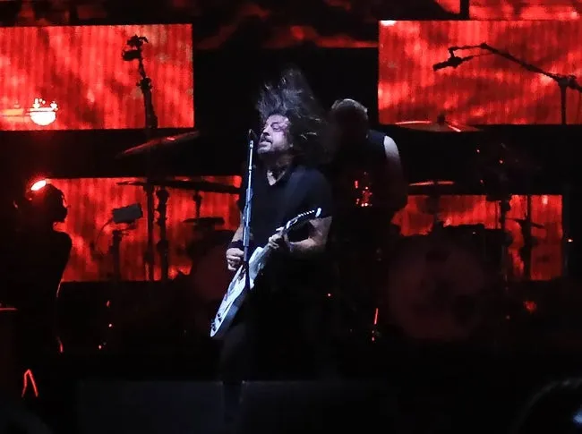 Dave Grohl flips his hair while performing with the Foo Fighters at Welcome to Rockville on Saturday, May 11, 2024 at Daytona International Speedway.